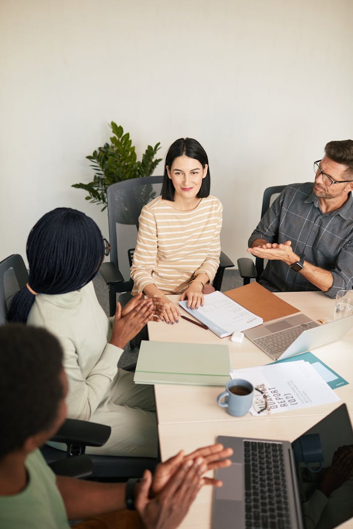 Professional team engaging in discussion in a modern office setting.